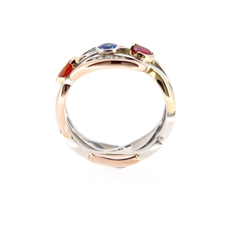 Handmade Platinum and Gold ring. Set with coloured Sapphires and a Ruby 