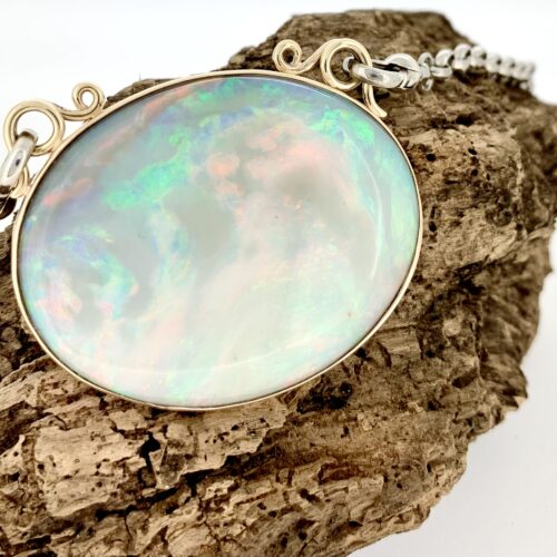 Handmade 9ct gold and sterling silver opal pendant