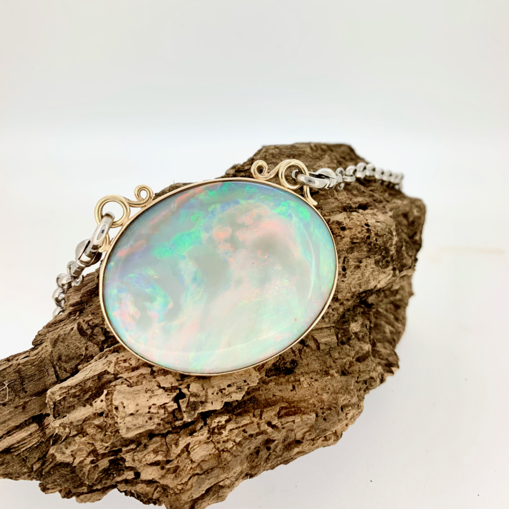 Handmade 9ct gold and sterling silver opal pendant