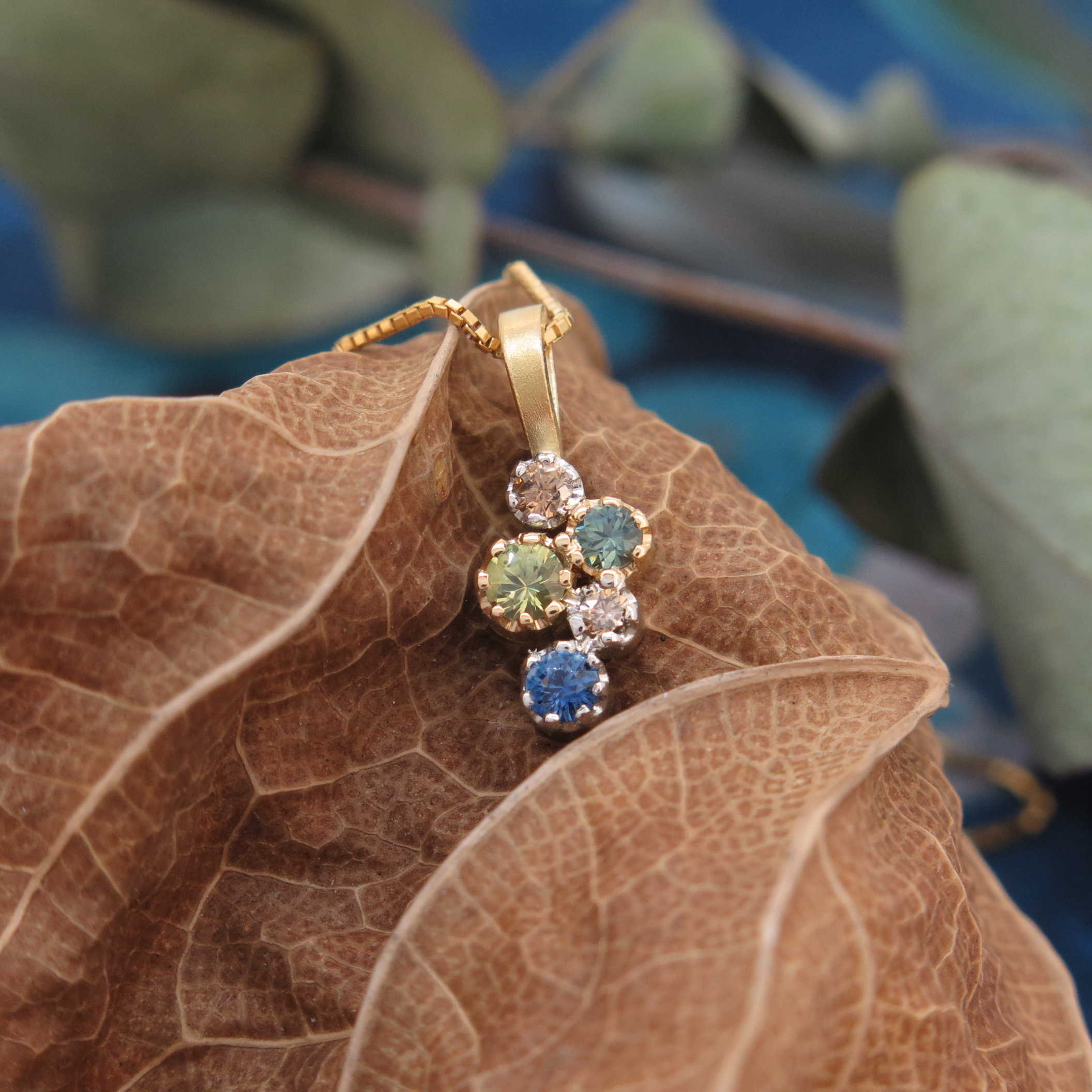 Handmade 18ct yellow gold, platinum, Sapphire and Diamond 'Star Cluster' pendant. Handmade 18ct yellow gold, platinum, Sapphire and Diamond 'Star Cluster' pendant.