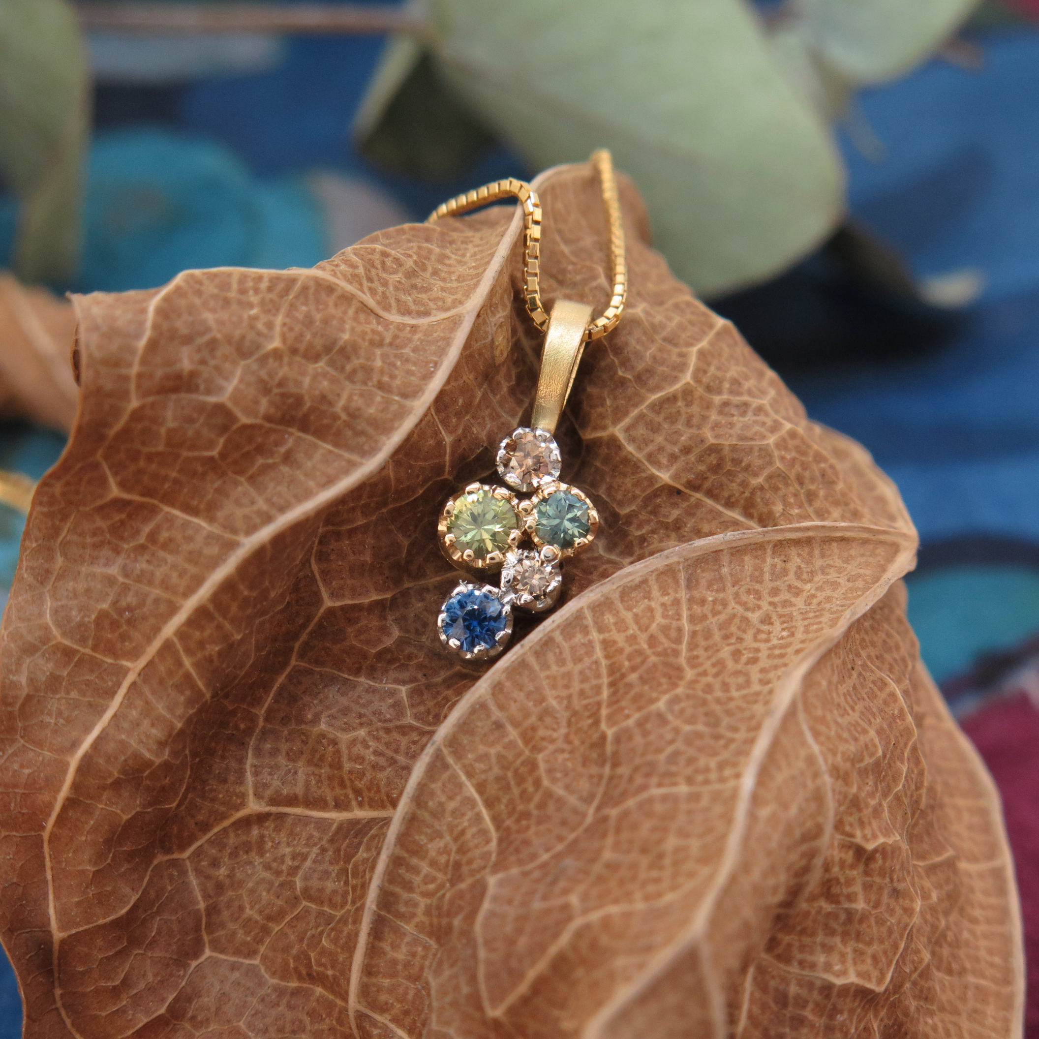 Handmade 18ct yellow gold, platinum, Sapphire and Diamond 'Star Cluster' pendant. Handmade 18ct yellow gold, platinum, Sapphire and Diamond 'Star Cluster' pendant.
